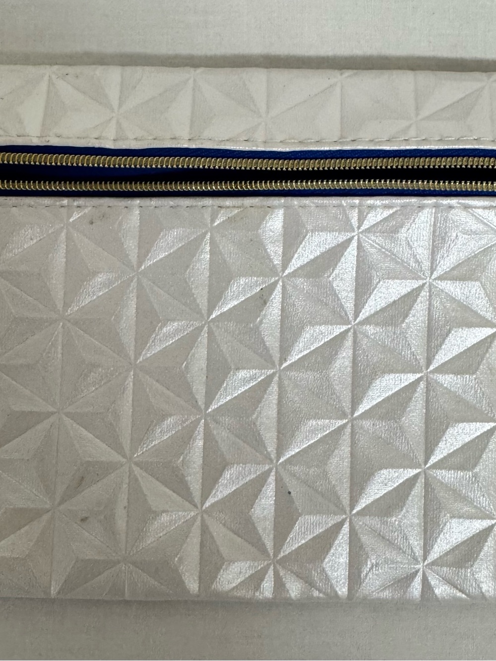 ipsy Silver Geometric Pouch with Gold Charm and Navy Trim